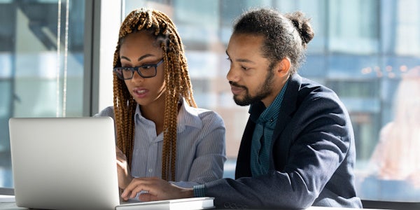 Accounting team working together on a laptop